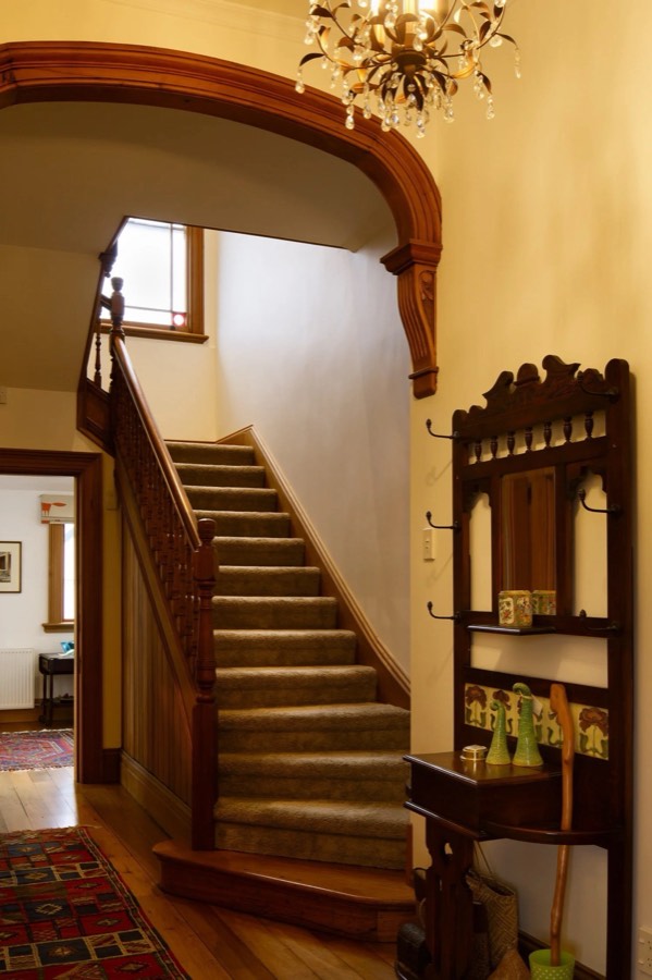 Original staircase and archway kept in a restored home