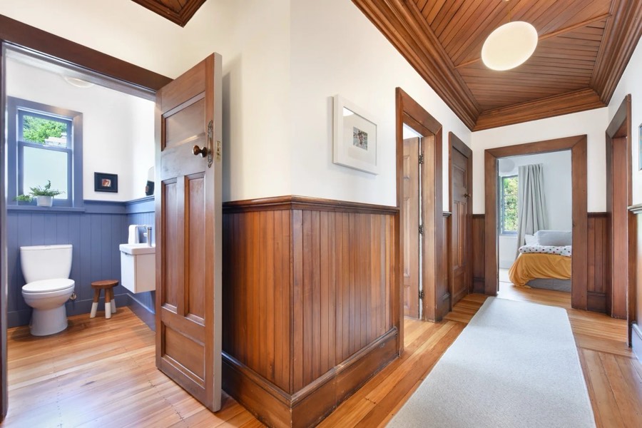 Timber-panelled hallway in a heritage home restored by Aspect Builders